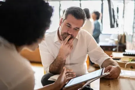 people reviewing paperwork